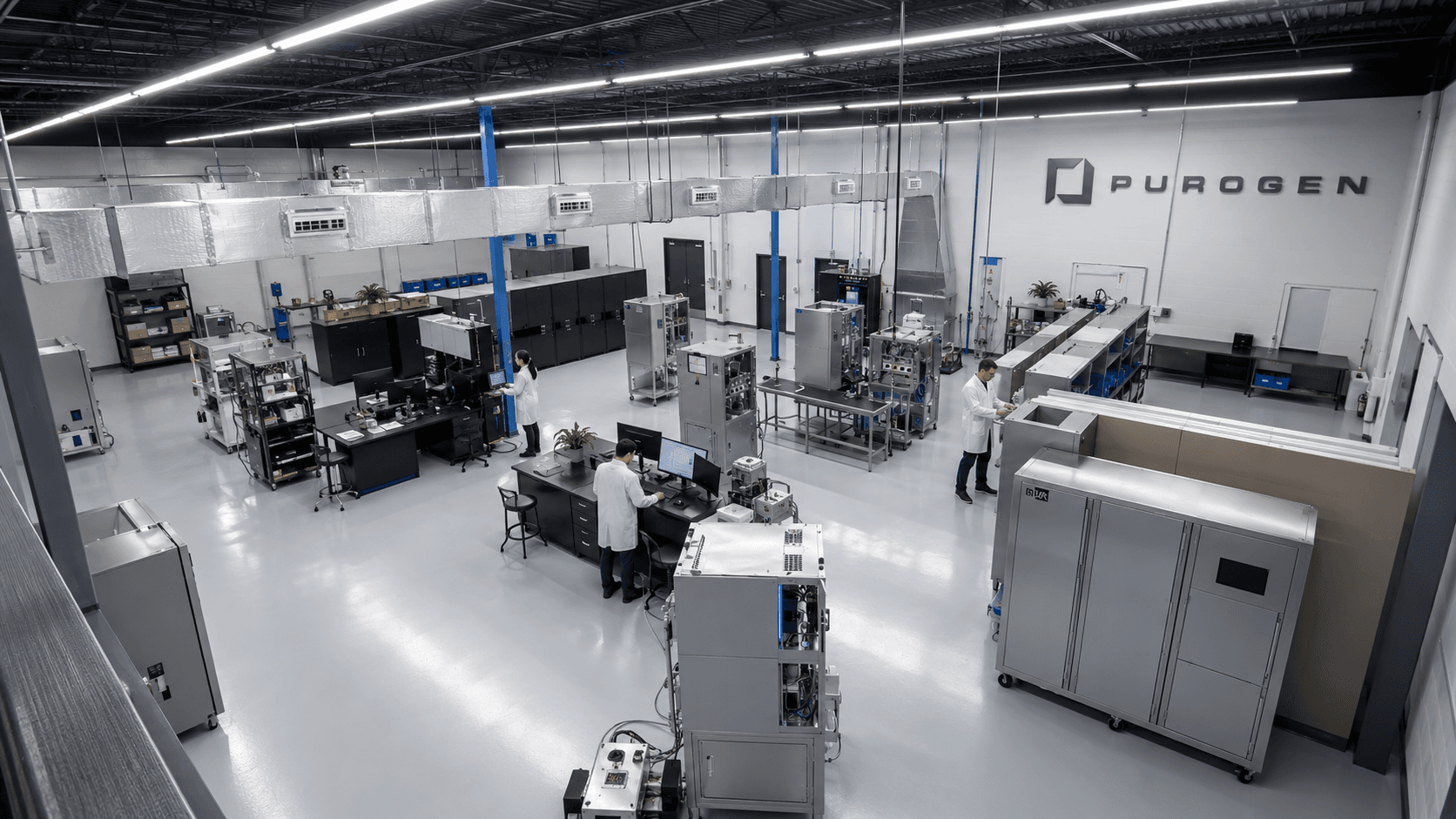 PuroGen manufacturing floor — engineers assembling and testing VHP sterilization systems at the company's production facility