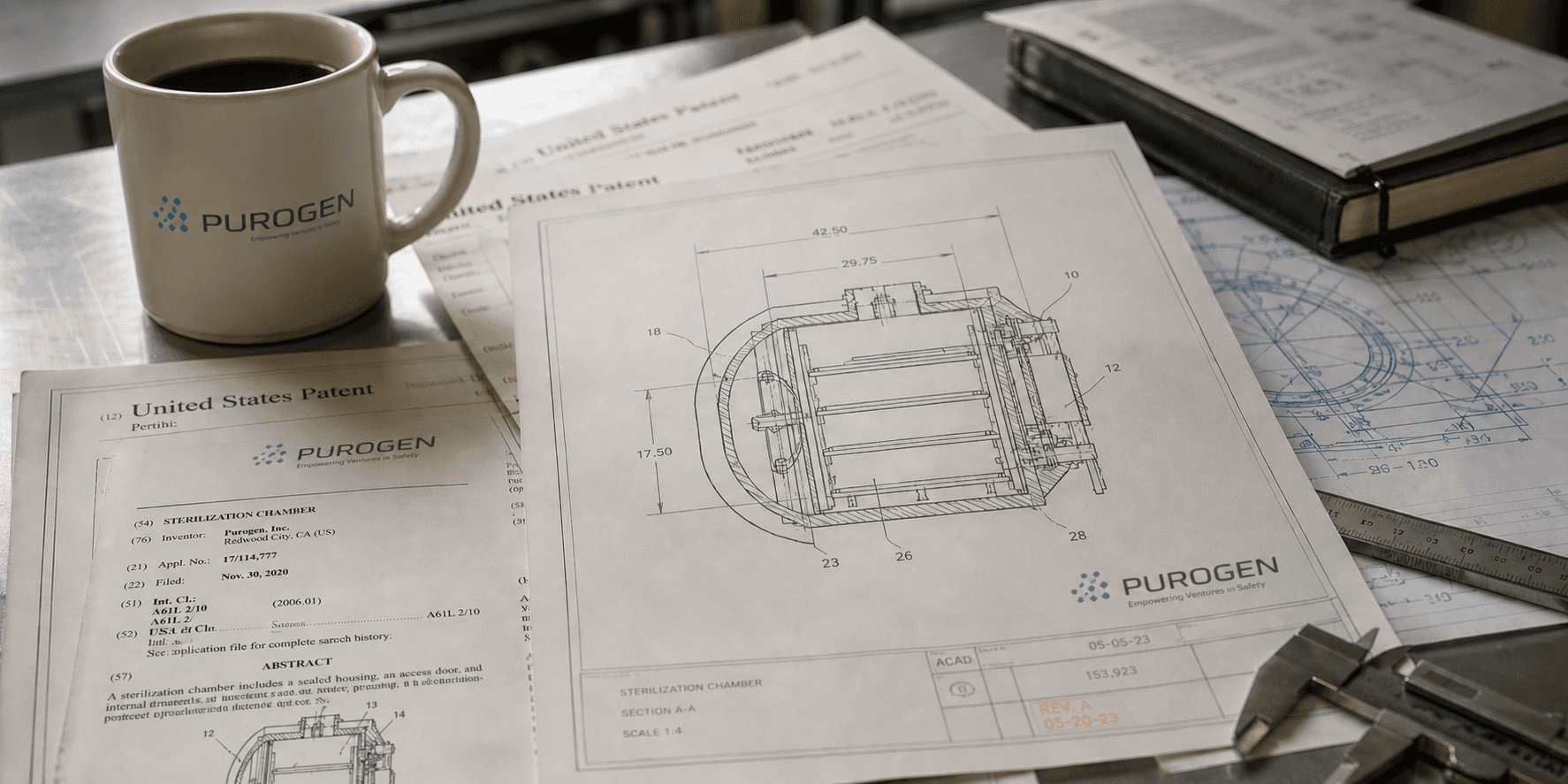 Patent documentation and engineering blueprints on drafting table